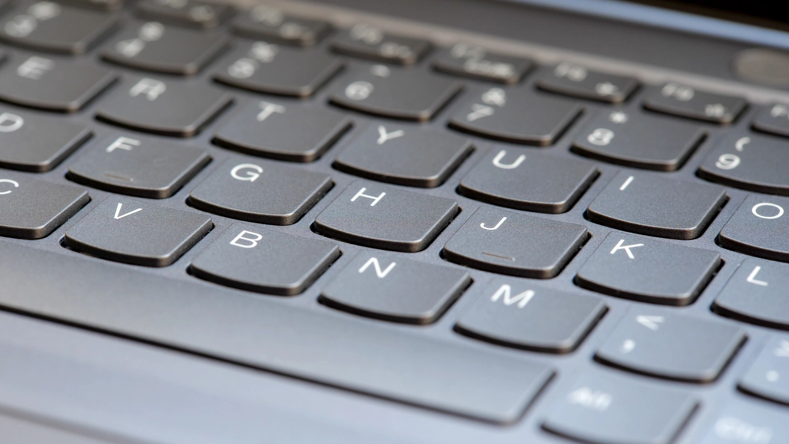 Modern laptop keyboard representing digital data handling